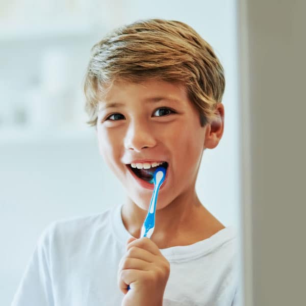 Brushing teeth at Cook Orthodontics in Augusta, ME