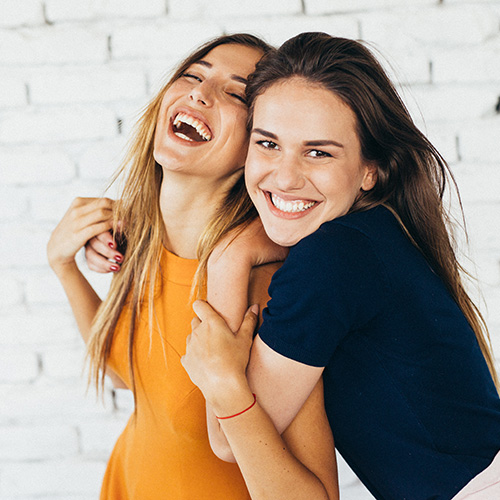 Friends smiling at Cook Orthodontics in Augusta, ME